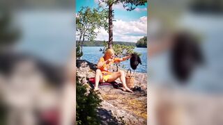 Blond Finnish MILF masturbating outdoors in public view, caught by passing boaters - 2 image