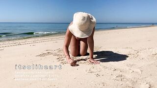 Nude public beach sunbathing with people passing by - 12 image