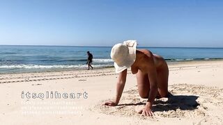 Nude public beach sunbathing with people passing by - 15 image