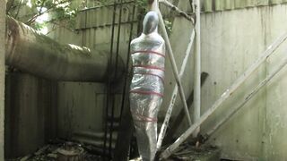 Bondaged and cocooned slave girl in the mystery garden - Full encasement fetish in zentai body bag - 4 image