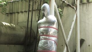 Bondaged and cocooned slave girl in the mystery garden - Full encasement fetish in zentai body bag - 6 image