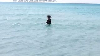 she walks naked on a public beach while her stepfather records a video. - 10 image