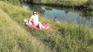 Nudist beach. Public nudity. Sexy MILF without panties and bra sunbathes naked is not shy about fisherman. Naked in public. Milf - 3 image
