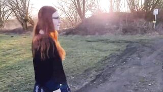 Redhead young woman undresses outside for the first time. - 2 image
