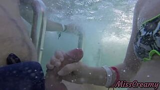 Teen student masturbate my cock in a public pool in front of everyone - it's very risky with people near- MissCreamy - 1 image