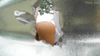 Woman recorded in outdoor booth (LATINA IN PUBLIC) - 7 image