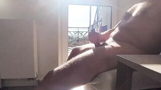 dickflash in a hotel where a maid comes through the balcony and gets cum on her tits - 4 image
