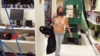 A sexy milf flash her boobs when she walk in different stores! - 12 image