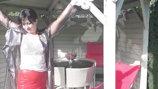 Garden, beautiful sunny day. Wanilianna in transparent raincoat, black seamed nylons - 5 image