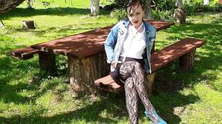 Wanking in stocking beneath the shady apple trees. - 2 image