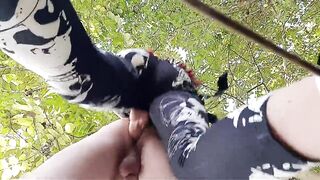 Femdom pegging. Strap-on in slave's ass outdoors in the bushes.