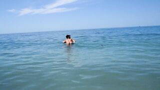 I spied on a nudist beach how a naked girl with big tits floats and sunbathes, naked in public - 3 image