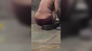 Desi Indian village bathroom in open courtyard wearing red tights bathing - 10 image