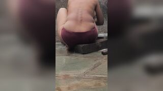 Desi Indian village bathroom in open courtyard wearing red tights bathing - 13 image