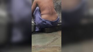 Desi Indian village bathroom in open courtyard wearing red tights bathing - 3 image