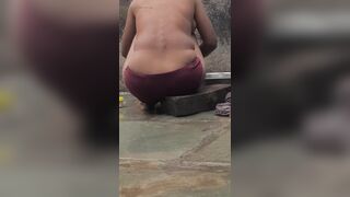 Desi Indian village bathroom in open courtyard wearing red tights bathing - 9 image