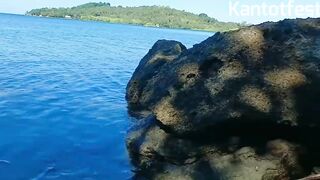 Pretty Pinay Can't Take It Anymore, She's Rubbing Herself on the Rocks at the Edge of the Sea That Has Houses - 2 image