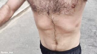 Naughty hairy guy training outdoors