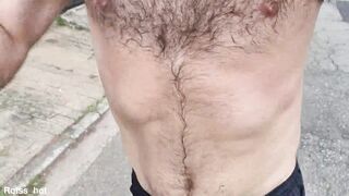 Naughty hairy guy training outdoors