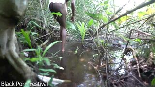 Skinny African tribe woman working outdoor