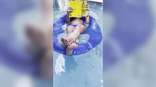Ignoring you while I float in the pool and read my book - 2 image