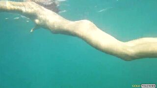 Nude model swims on a public beach in Russia. - 13 image