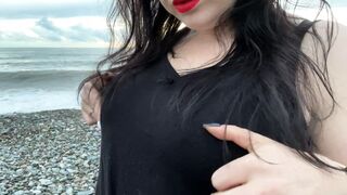 Hot Mistress Lara is touching her big tits and masturbates at public beach - 1 image