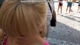 Sexy girl shows tits in the middle of a lively square - 5 image