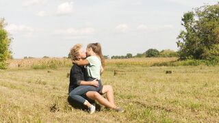 Beautiful Teen Couple in Love Passionately Kissing on the field - 11 image