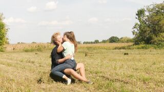 Beautiful Teen Couple in Love Passionately Kissing on the field - 13 image