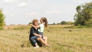 Beautiful Teen Couple in Love Passionately Kissing on the field - 2 image