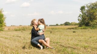 Beautiful Teen Couple in Love Passionately Kissing on the field - 5 image