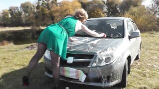 Milf beautiful sexy blonde outdoors on river bank washes car without panties and bra under dress. No panties in public - 2 image